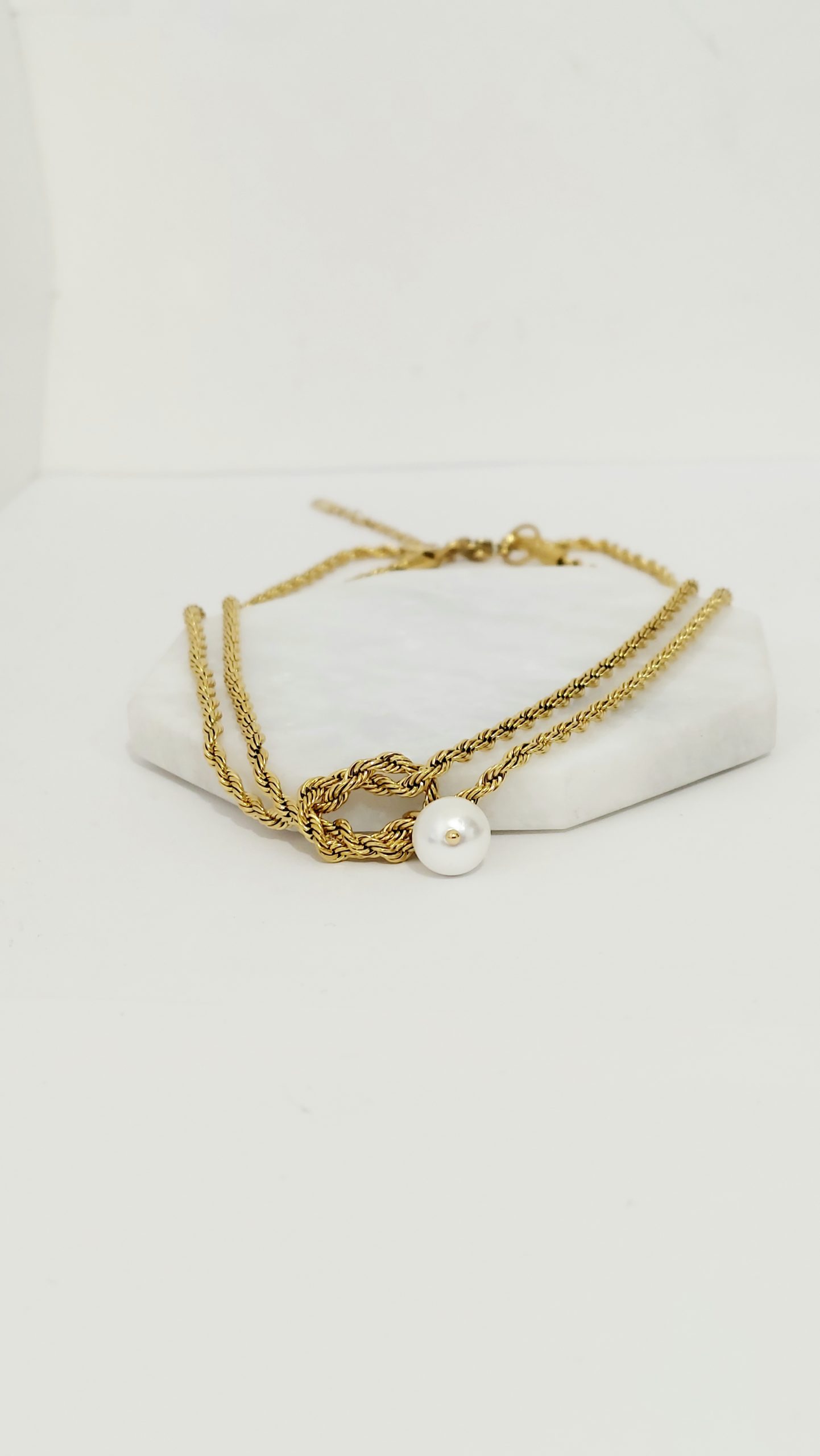 COLLAR NUDO CON PERLA COLGANTE