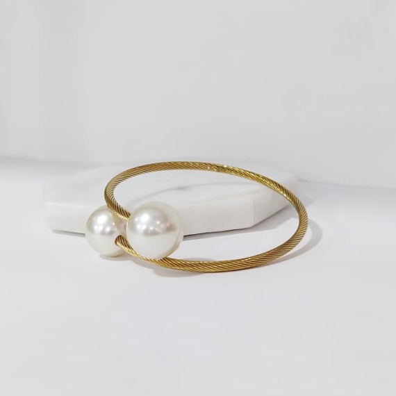 PULSERA BANGLE CON PERLAS EN ORILLAS